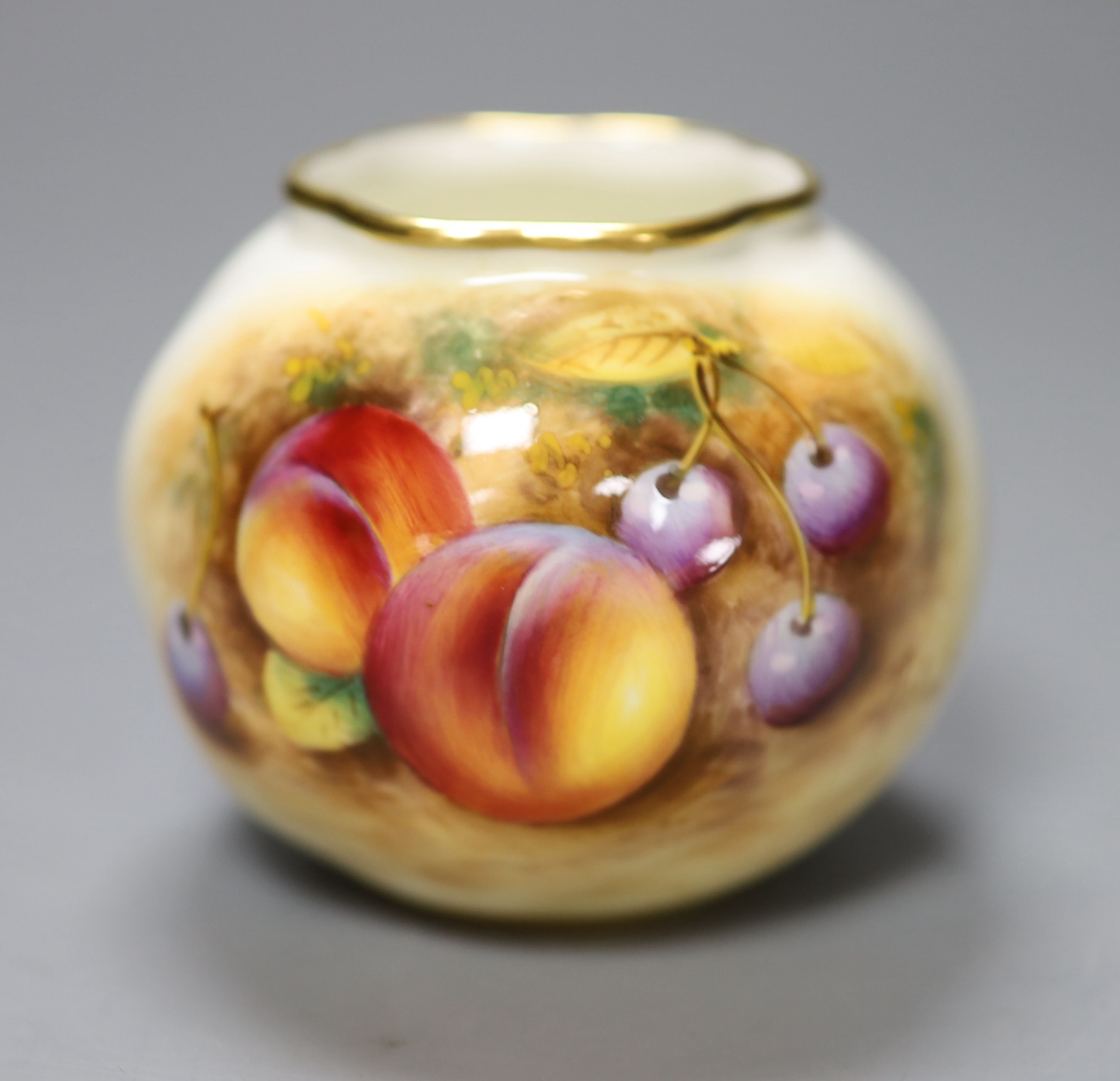 A Royal Worcester spirally globular vase painted with fruit by Roberts, signed, black mark, height 7cm